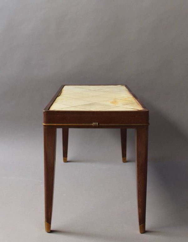 A Fine French Art Deco Mahogany Coffee Table with a Parchment Top and Bronze Details - Image 7