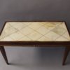 A Fine French Art Deco Rosewood Coffee Table with a Parchment Top and Bronze Details