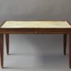 A Fine French Art Deco Rosewood Coffee Table with a Parchment Top and Bronze Details