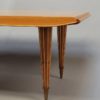 A Fine French Art Deco Expandable Dining Table with Ribbed Brass Conical Legs