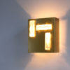 A French 1970s Bronze and Glass Slab Sconce by Perzel.
